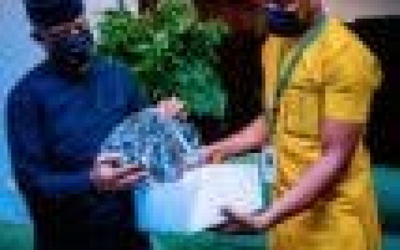 Osinbajo encourages Nigerian shoemaker, wears his product