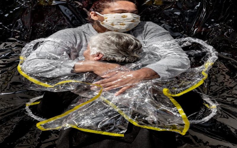 Image of pandemic embrace wins World Press Photo award