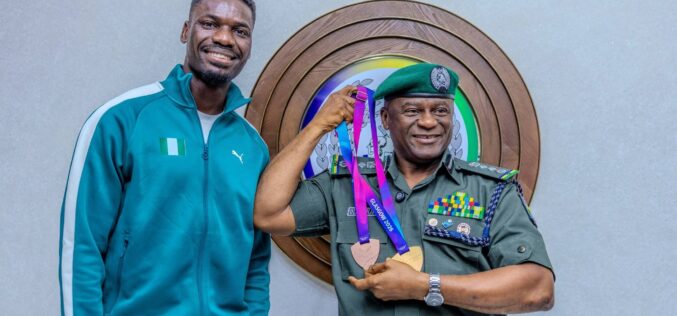 IGP Disu receives Commonwealth Games Champion Ezekiel Nathaniel