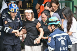 Teen kills grandparents, six others in Thailand school shooting