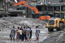 Rescuers claw through mud as Nepal, China flood missing toll nears 3,000