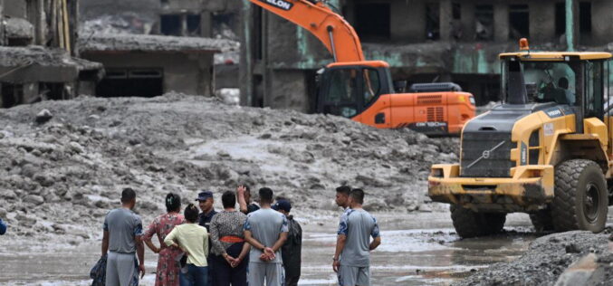 Rescuers claw through mud as Nepal, China flood missing toll nears 3,000