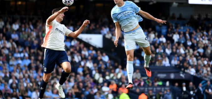 Haaland heads unconvincing Man City top of Premier League